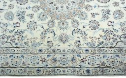 Corner detail of 2000s Nain rug showing border pattern and Wool pile