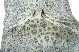 Surface texture of 2000s Nain rug with natural Wool and intricate pattern