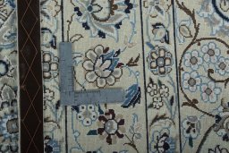 Backside of handmade 2000s Nain rug showing knot structure and weave density