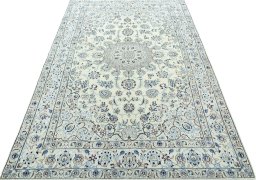 Surface texture of 2000s Nain rug with natural Wool and intricate pattern
