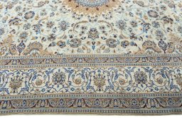 Corner detail of 2000s Nain rug showing border pattern and Wool pile