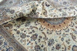 Surface texture of 2000s Nain rug with natural Wool and intricate pattern
