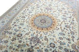 Backside of handmade 2000s Nain rug showing knot structure and weave density