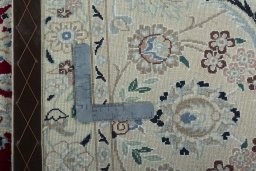 Backside of handmade New Nain rug showing knot structure and weave density