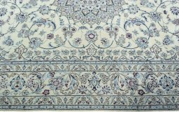 Corner detail of 2000s Nain rug showing border pattern and Wool pile