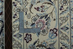 Backside of handmade 2000s Nain rug showing knot structure and weave density