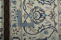 Backside of handmade New Nain rug showing knot structure and weave density