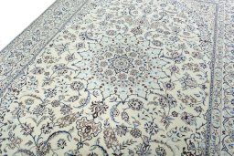 Backside of handmade New Nain rug showing knot structure and weave density