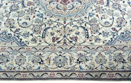 Corner detail of 2000s Nain rug showing border pattern and Wool pile