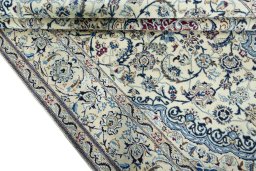 Close-up detail of 2000s Nain rug from Iran / Persia showing Wool weave