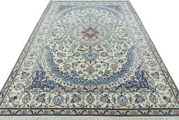 Surface texture of 2000s Nain rug with natural Wool and intricate pattern