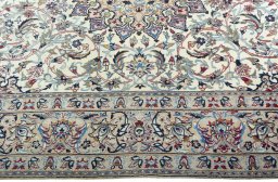 Corner detail of 2000s Nain rug showing border pattern and Wool pile
