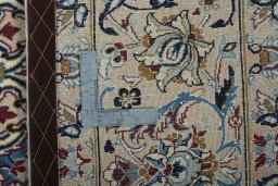Backside of handmade 2000s Nain rug showing knot structure and weave density
