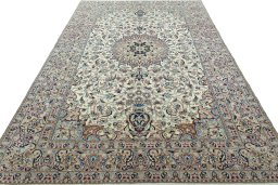 Surface texture of 2000s Nain rug with natural Wool and intricate pattern