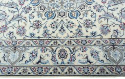 Corner detail of 2000s Nain rug showing border pattern and Wool pile