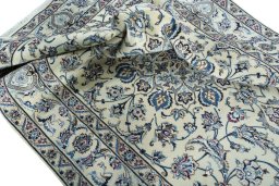 Surface texture of 2000s Nain rug with natural Wool and intricate pattern