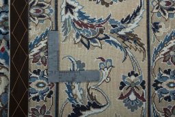 Backside of handmade 2000s Nain rug showing knot structure and weave density