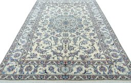 Surface texture of 2000s Nain rug with natural Wool and intricate pattern