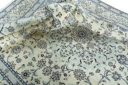 Surface texture of 2000s Nain rug with natural Wool and intricate pattern