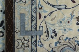 Backside of handmade 2000s Nain rug showing knot structure and weave density