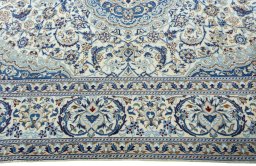 Corner detail of 2000s Nain rug showing border pattern and Wool pile