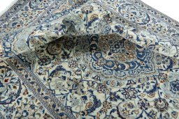 Surface texture of 2000s Nain rug with natural Wool and intricate pattern