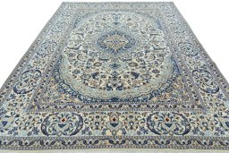 Surface texture of 2000s Nain rug with natural Wool and intricate pattern