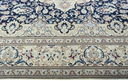 Corner detail of 2000s Nain rug showing border pattern and Wool pile