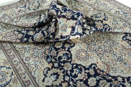 Surface texture of 2000s Nain rug with natural Wool and intricate pattern