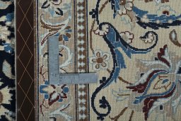 Backside of handmade 2000s Nain rug showing knot structure and weave density