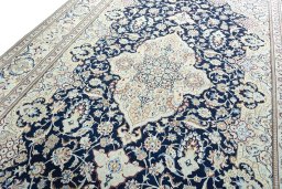 Backside of handmade 2000s Nain rug showing knot structure and weave density