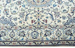 Corner detail of 2000s Nain rug showing border pattern and Wool pile