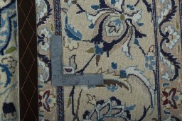 Backside of handmade 2000s Nain rug showing knot structure and weave density