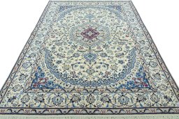 Surface texture of 2000s Nain rug with natural Wool and intricate pattern