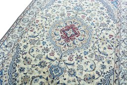 Backside of handmade 2000s Nain rug showing knot structure and weave density