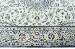 Corner detail of 2000s Nain rug showing border pattern and Wool pile