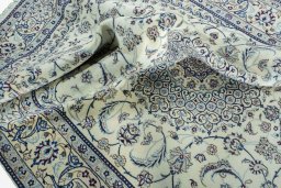 Surface texture of 2000s Nain rug with natural Wool and intricate pattern