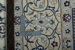 Backside of handmade 2000s Nain rug showing knot structure and weave density