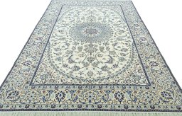 Surface texture of 2000s Nain rug with natural Wool and intricate pattern