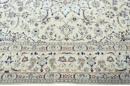 Corner detail of 2000s Nain rug showing border pattern and Wool pile