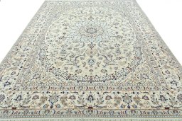 Surface texture of 2000s Nain rug with natural Wool and intricate pattern