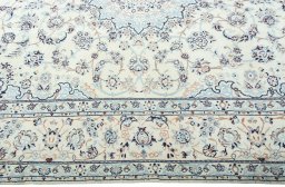 Corner detail of New Nain rug showing border pattern and Wool pile