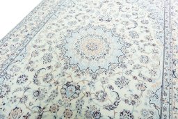 Backside of handmade New Nain rug showing knot structure and weave density