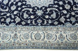 Corner detail of New Nain rug showing border pattern and Wool pile