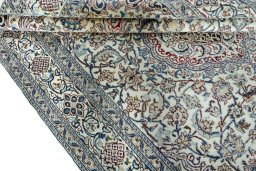 Close-up detail of 2000s Nain rug from Iran / Persia showing Wool weave