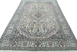 Surface texture of 2000s Nain rug with natural Wool and intricate pattern