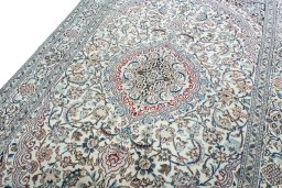 Backside of handmade 2000s Nain rug showing knot structure and weave density