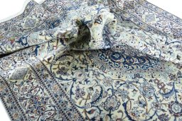 Surface texture of 2000s Nain rug with natural Wool and intricate pattern