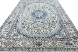 Surface texture of 2000s Nain rug with natural Wool and intricate pattern