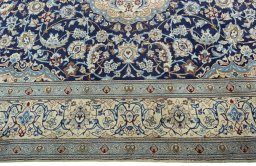 Corner detail of 2000s Nain rug showing border pattern and Wool pile